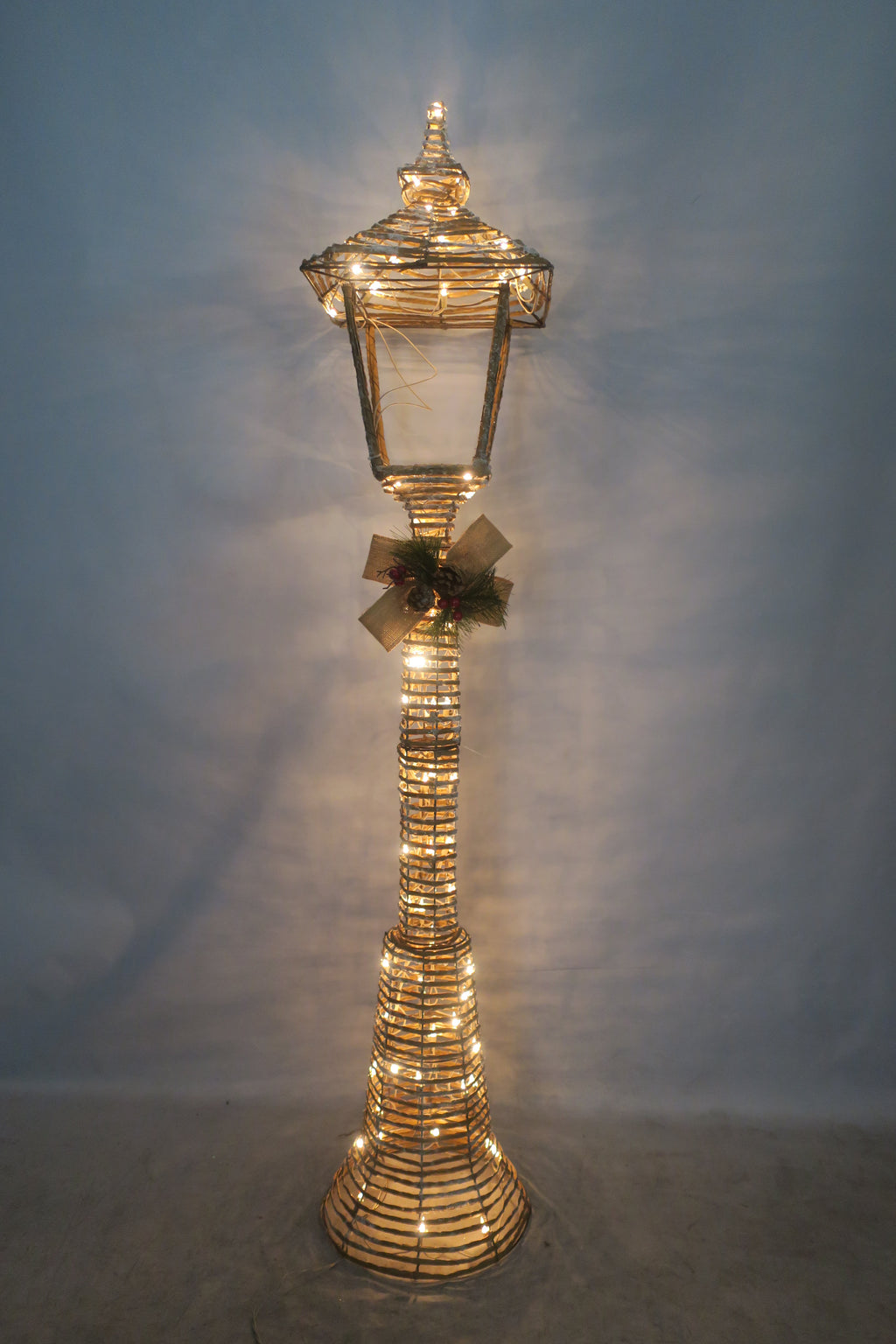 60-inch wicker-style street lamp light with 100 warm LEDs.