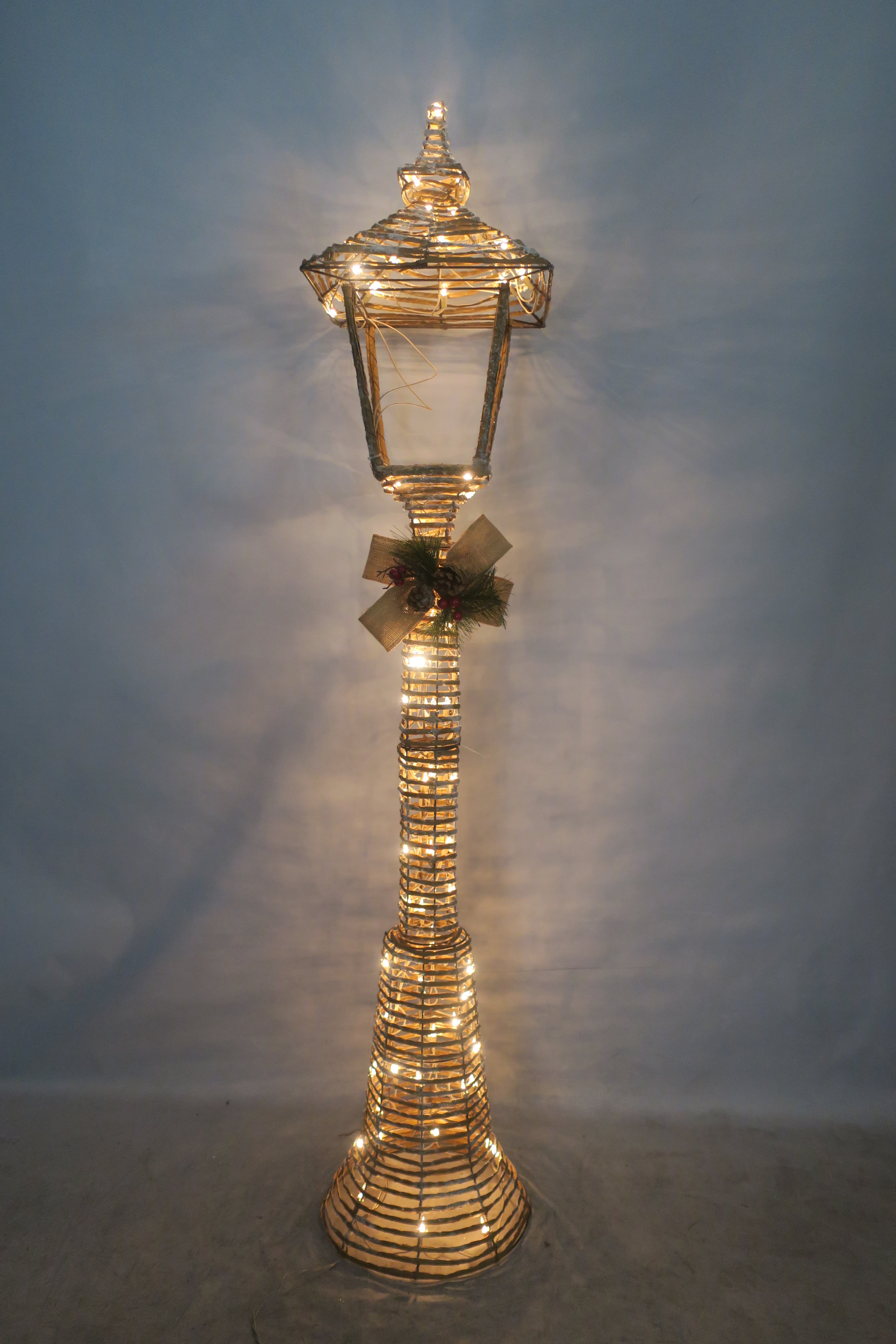 60-inch wicker-style street lamp light with 100 warm LEDs.