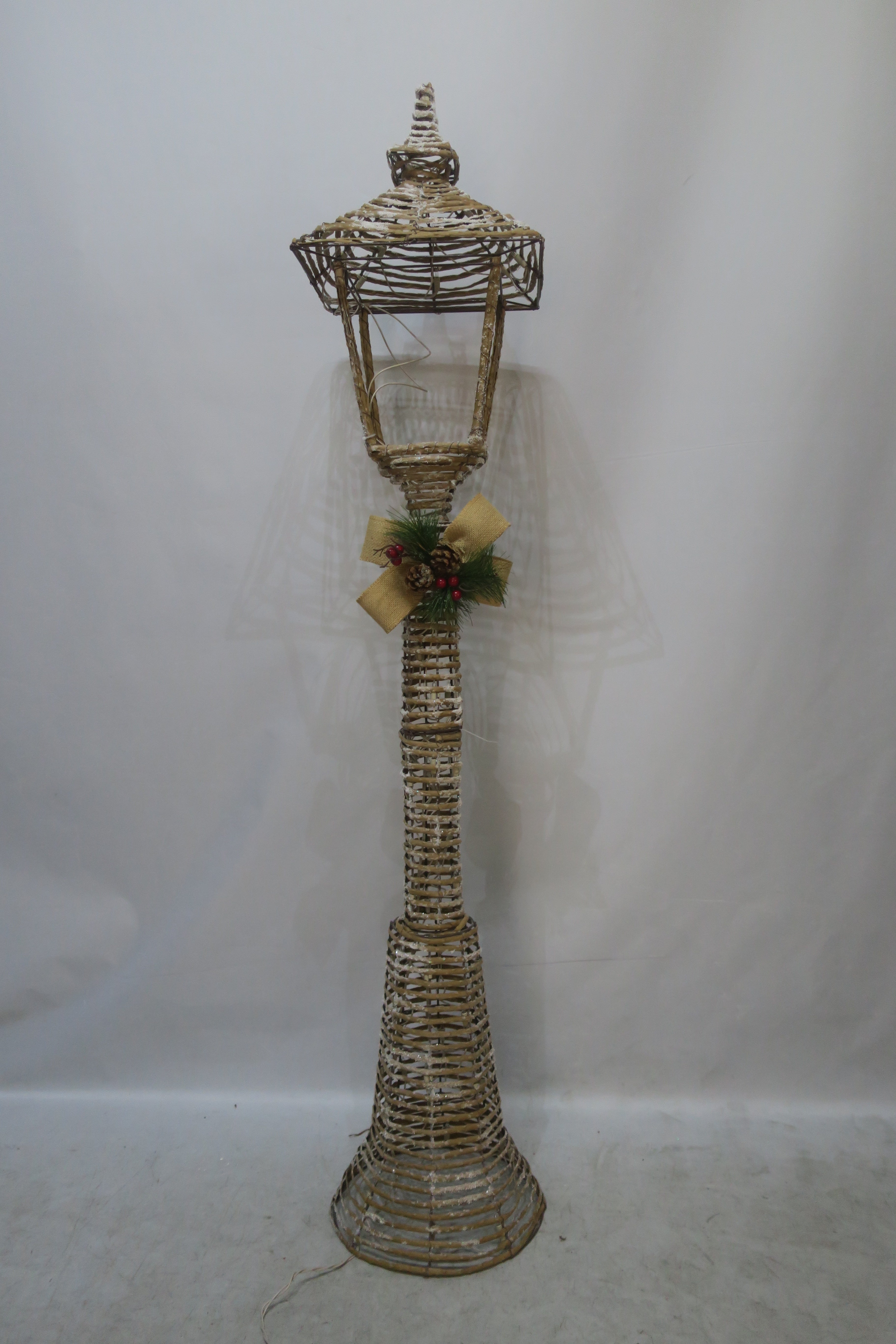 60-inch wicker-style street lamp light with 100 warm LEDs.